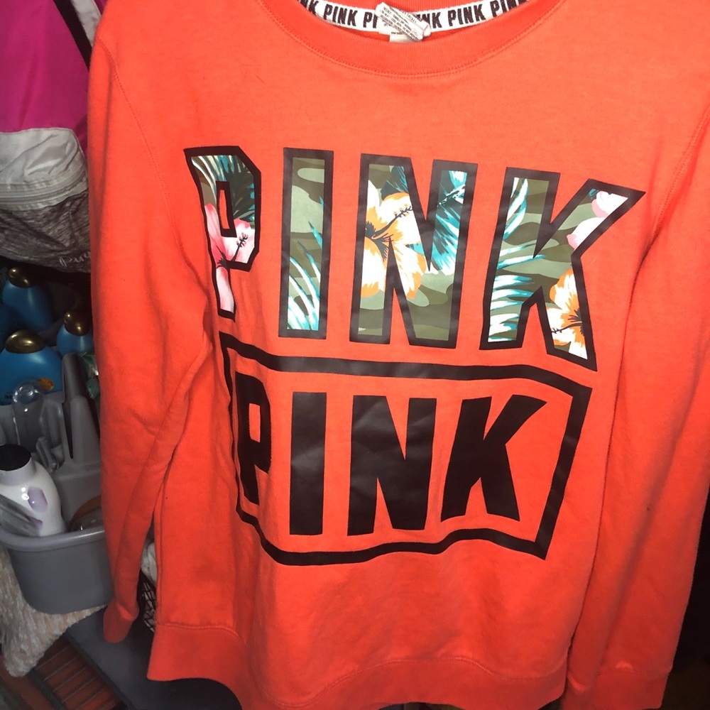 a orange PINK crew neck